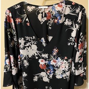 Cute blouse.  In great condition and a smoke free home